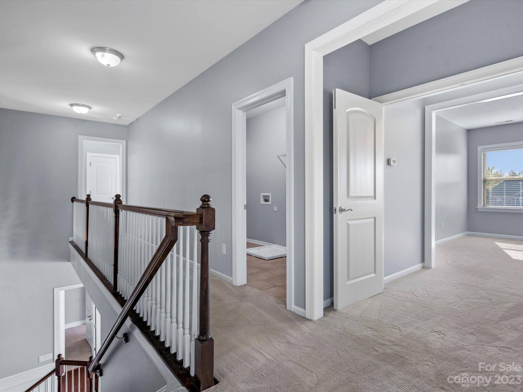 7009 Fallondale Road Waxhaw, NC 28173 - Photo 31 of 47 a view of a hallway with staircase