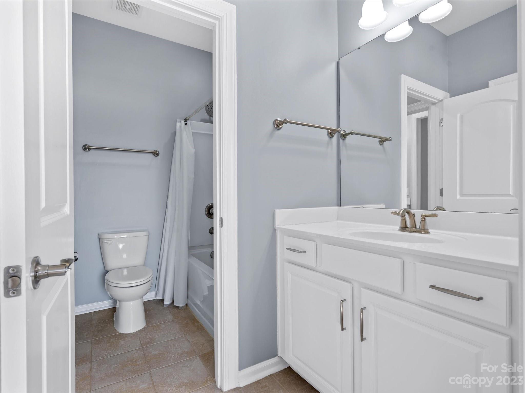 7009 Fallondale Road Waxhaw, NC 28173 - Photo 40 of 47 a bathroom with a sink a toilet and shower
