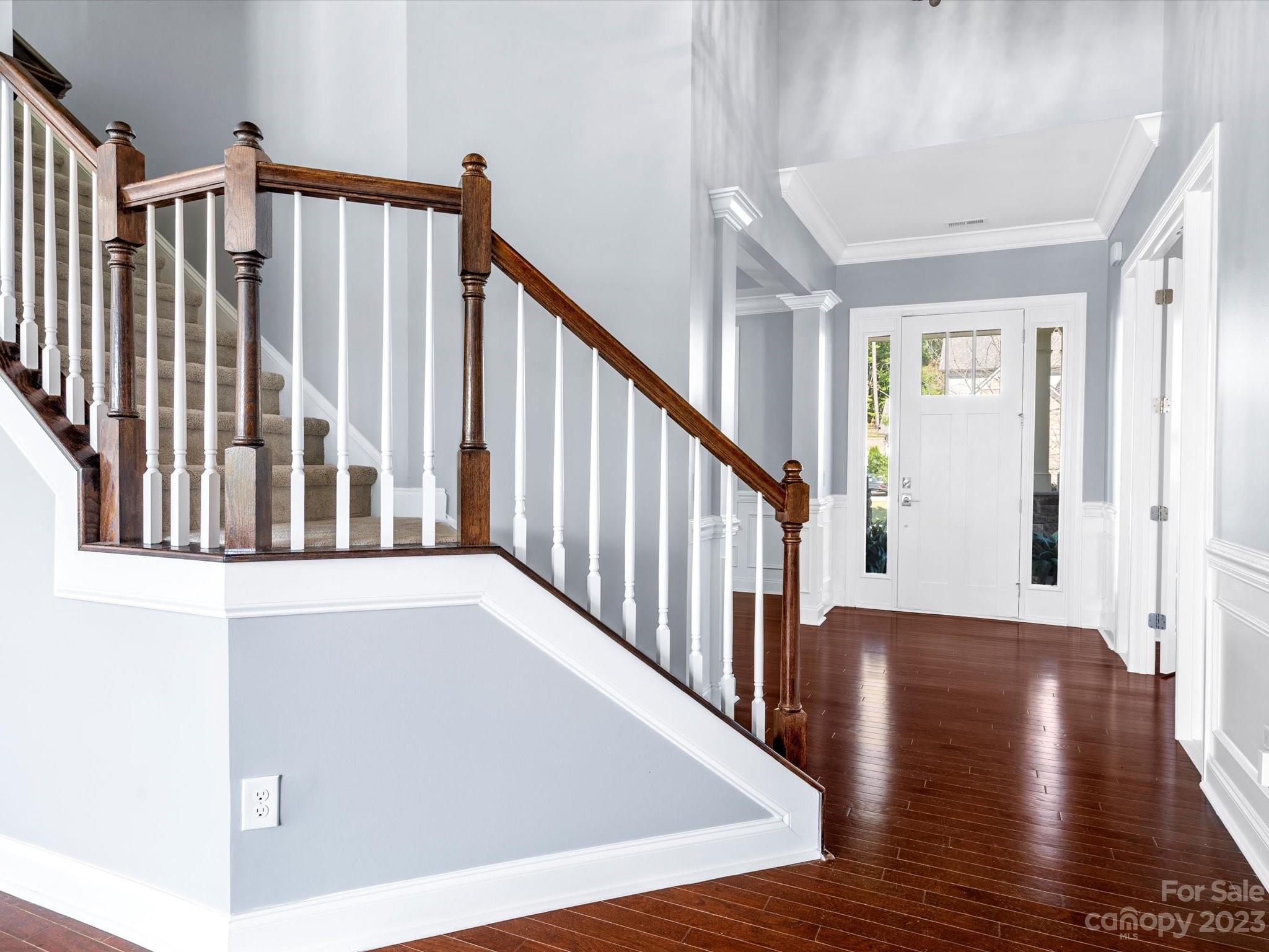 7009 Fallondale Road Waxhaw, NC 28173 - Photo 4 of 47 a view of staircase with wooden floor and stairs