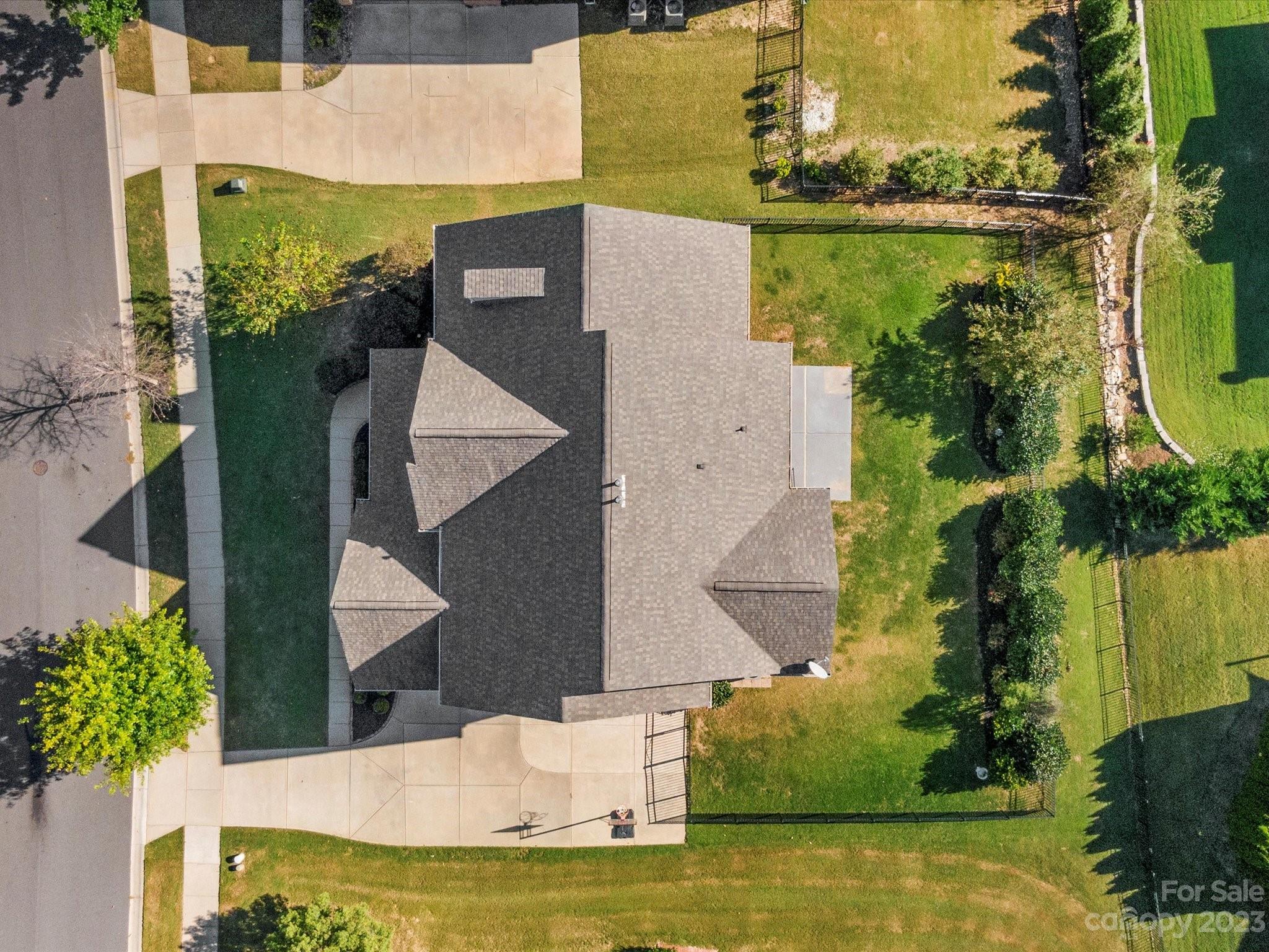 7009 Fallondale Road Waxhaw, NC 28173 - Photo 45 of 47 an aerial view of a house with a yard swimming pool and outdoor seating