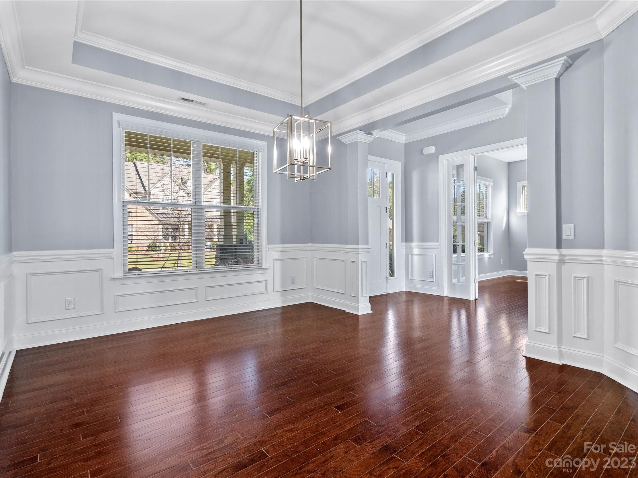 7009 Fallondale Road Waxhaw, NC 28173 - Photo 6 of 47 a view of an empty room with wooden floor and a window