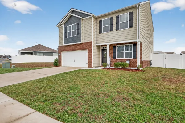 a view of a house with a yard