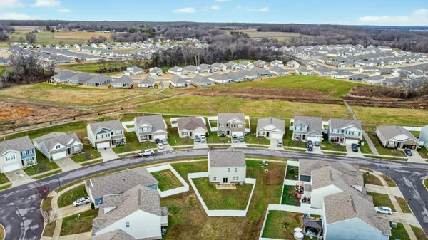an aerial view of a residential apartment building with a yard