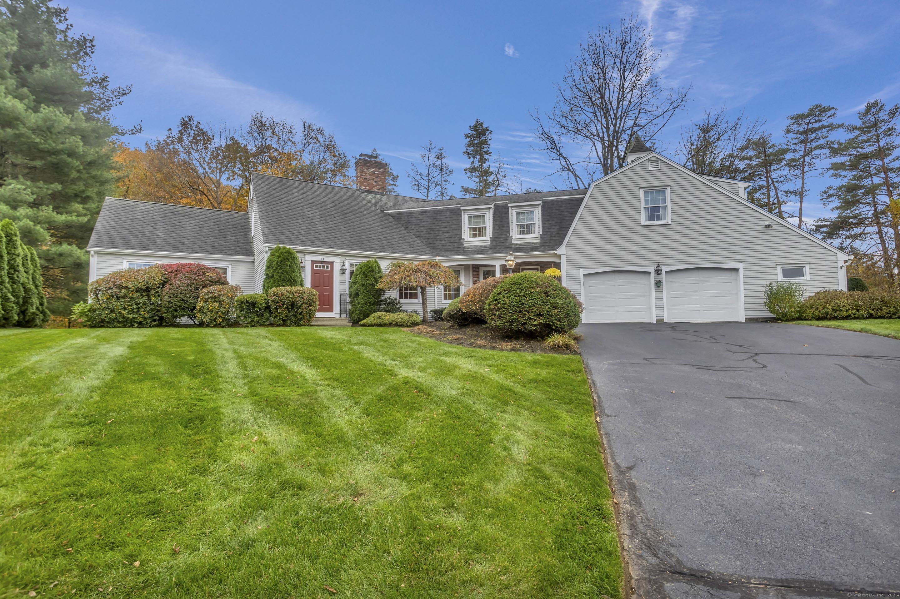 41 Huckleberry Hollow Suffield, CT 06078 - Photo 1 of 40 a front view of a house with a yard and garage