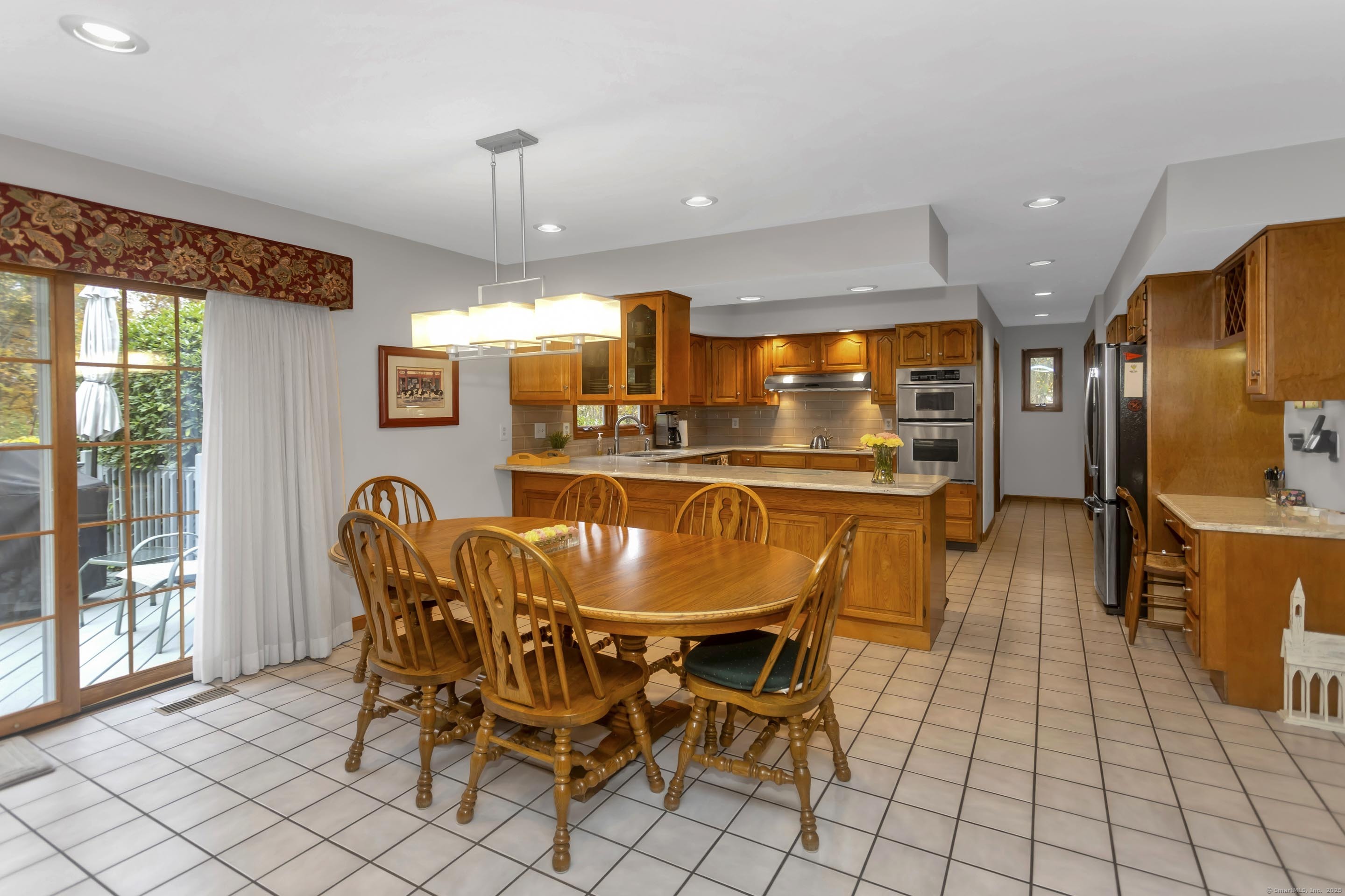 41 Huckleberry Hollow Suffield, CT 06078 - Photo 13 of 40 a dining room with furniture a chandelier and window