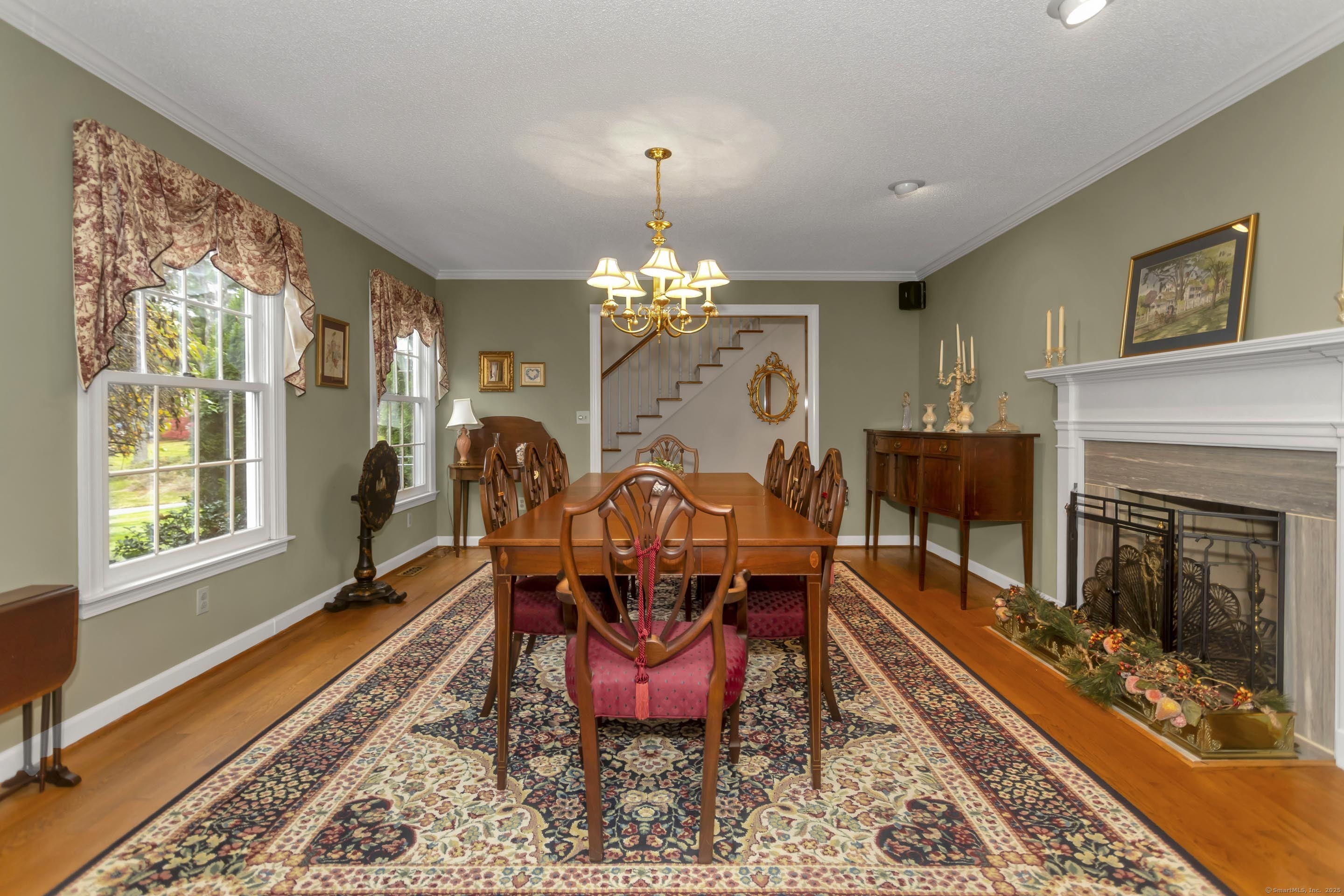41 Huckleberry Hollow Suffield, CT 06078 - Photo 17 of 40 a view of a dining room with furniture a chandelier and wooden floor
