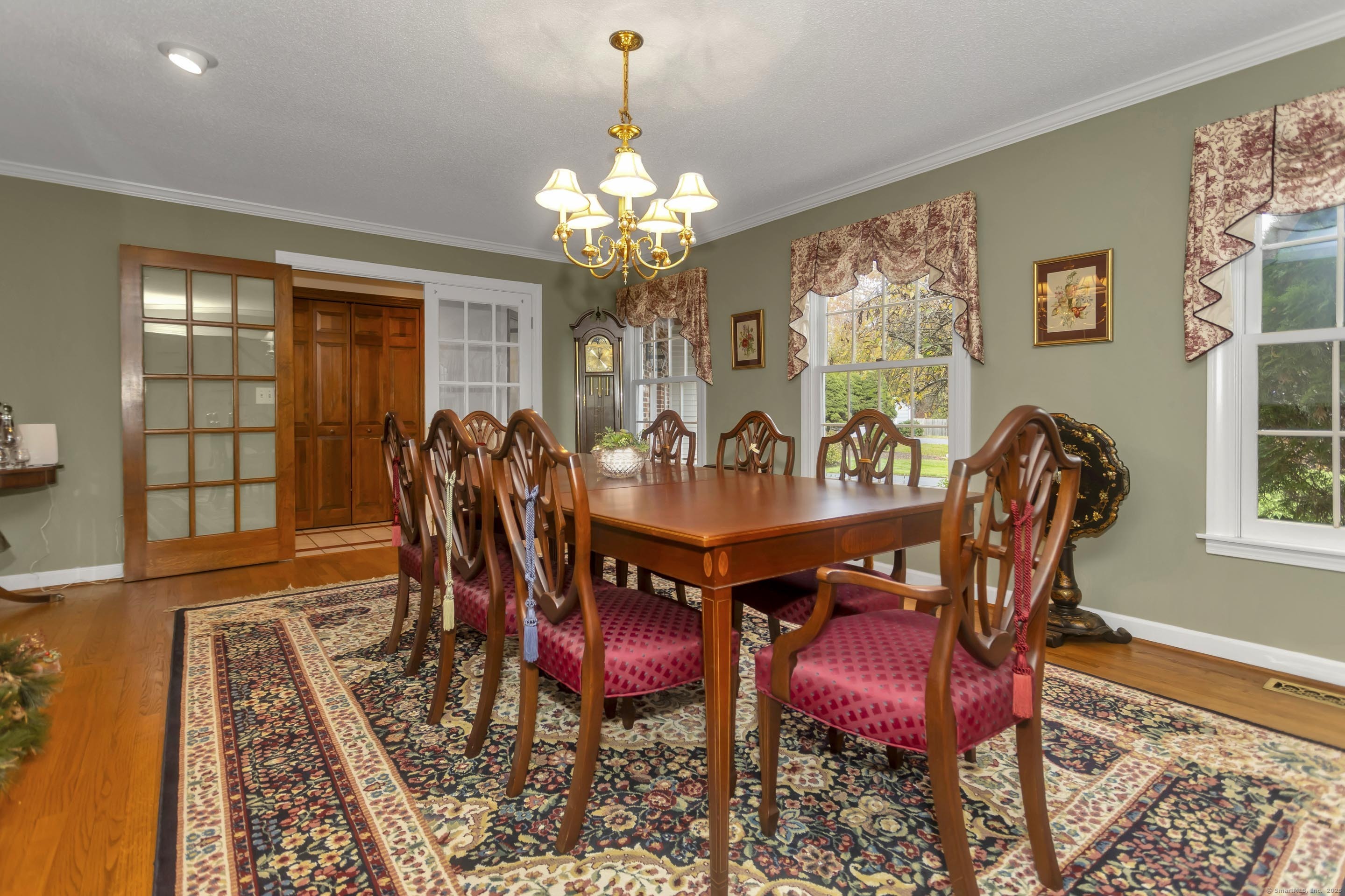 41 Huckleberry Hollow Suffield, CT 06078 - Photo 18 of 40 a view of a dining room with furniture a chandelier and wooden floor
