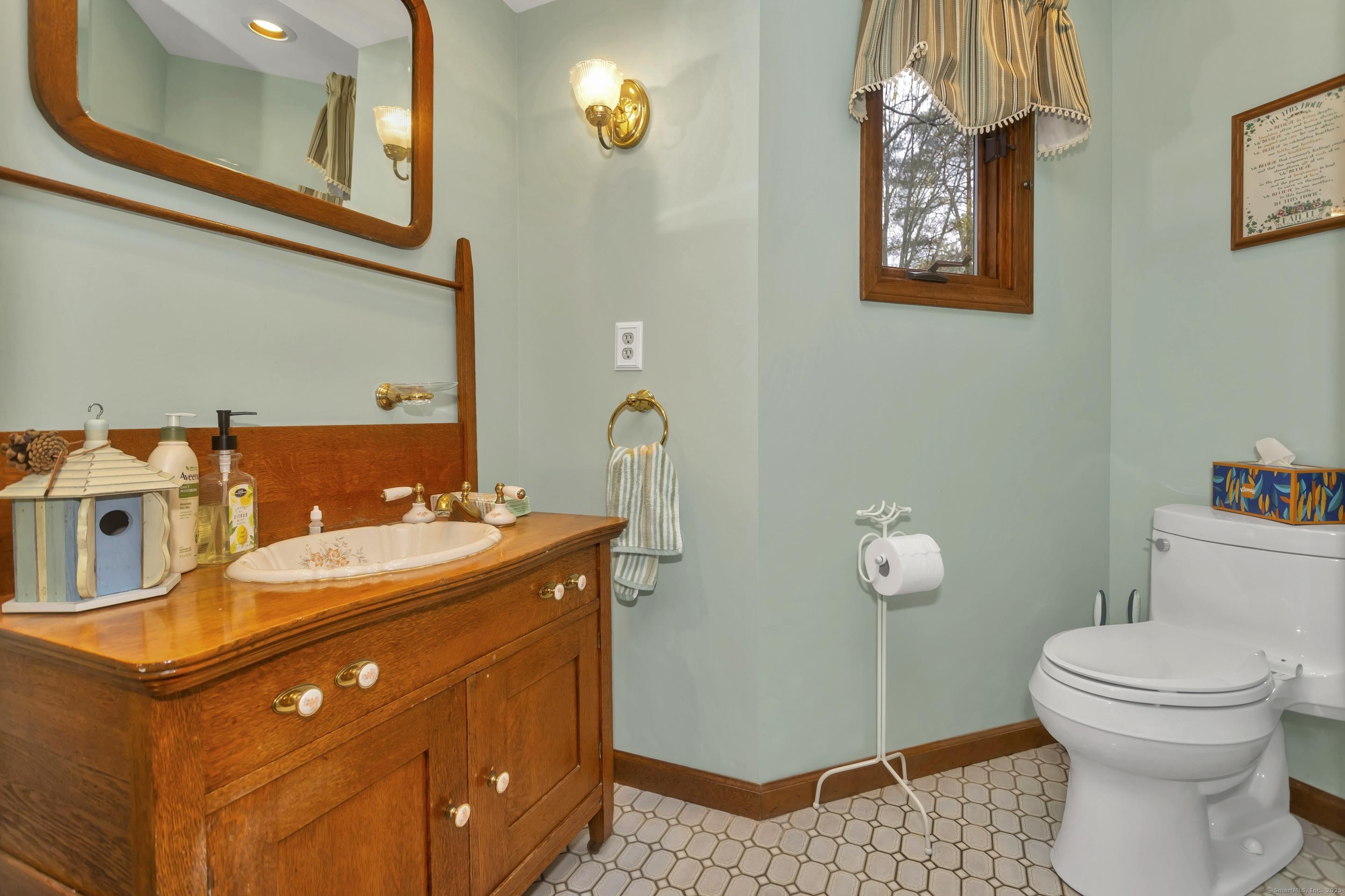 41 Huckleberry Hollow Suffield, CT 06078 - Photo 20 of 40 a bathroom with a sink a toilet and mirror