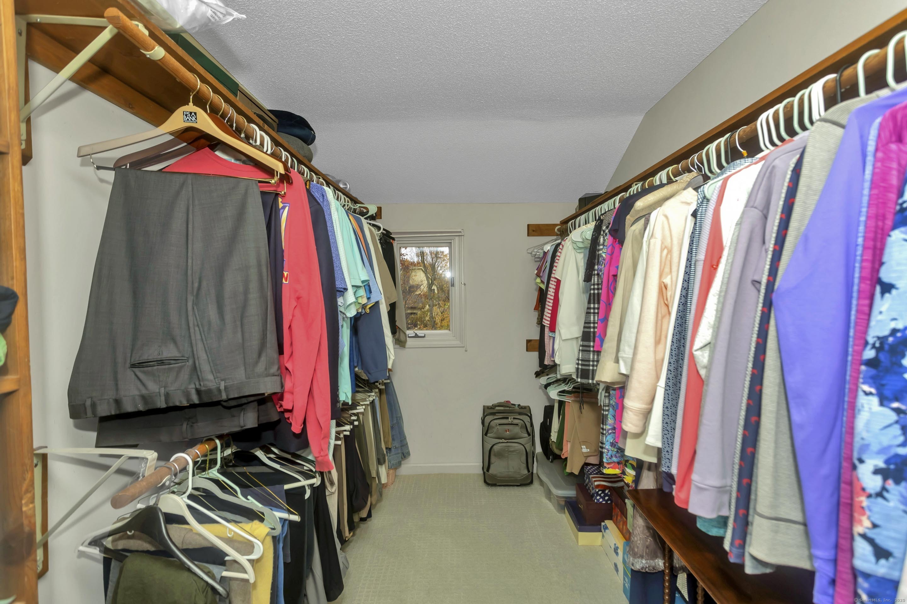 41 Huckleberry Hollow Suffield, CT 06078 - Photo 27 of 40 a view of walk in closet with clothes
