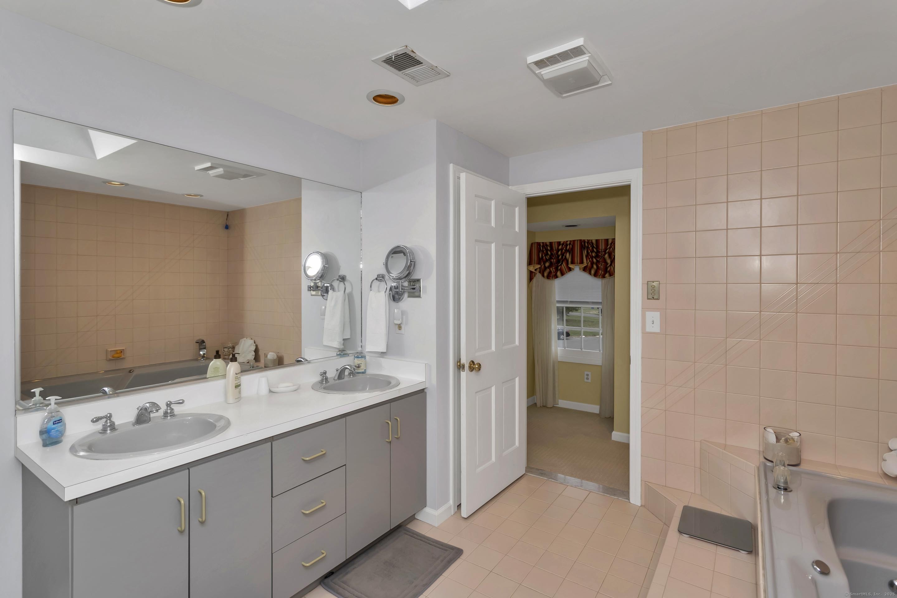 41 Huckleberry Hollow Suffield, CT 06078 - Photo 30 of 40 a bathroom with a sink and a mirror