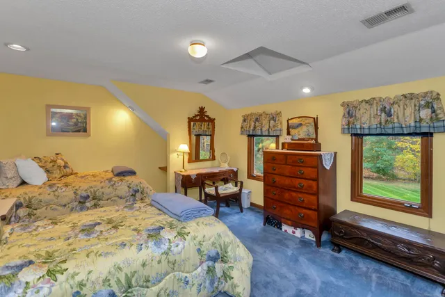 a bedroom with a bed and furniture