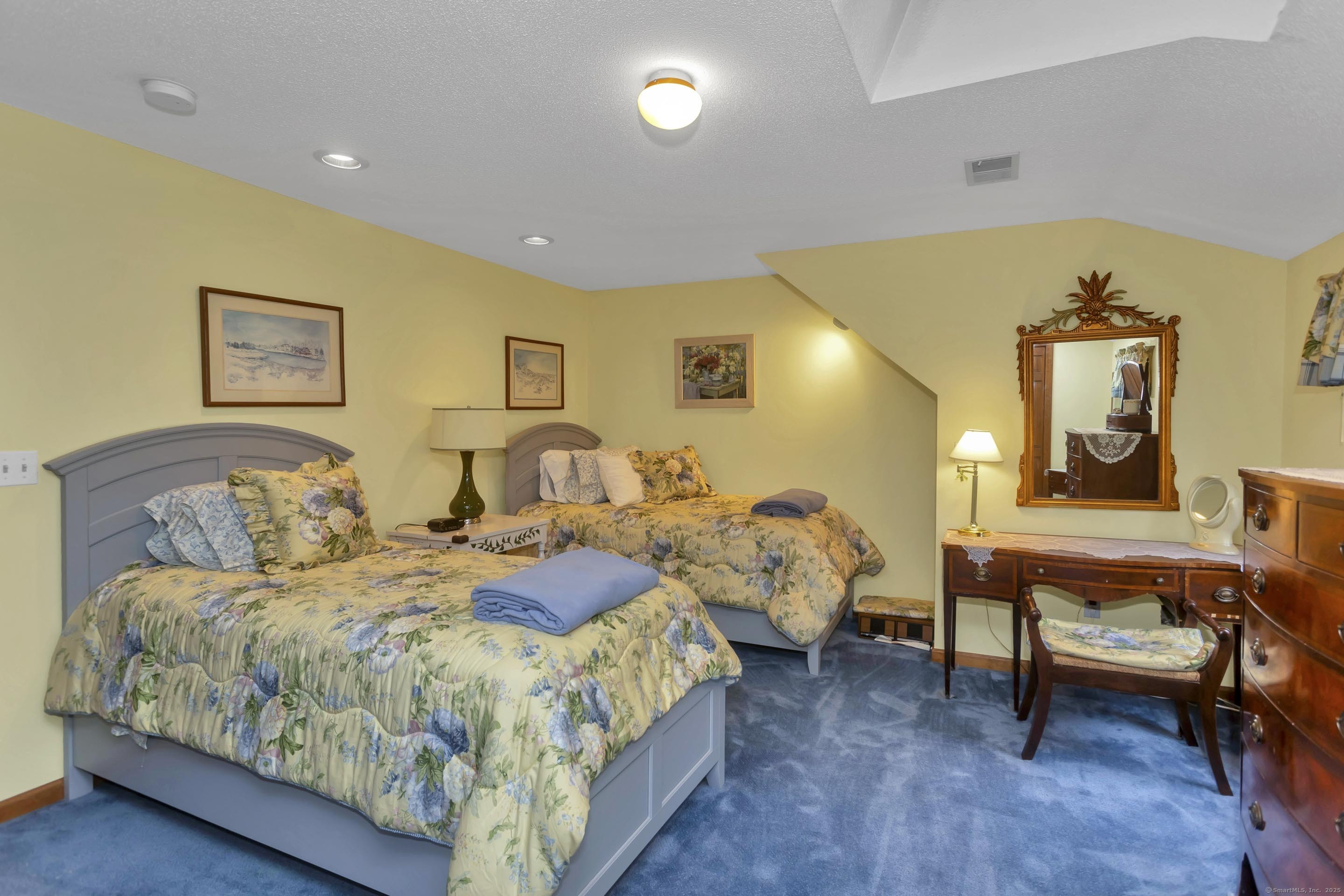 41 Huckleberry Hollow Suffield, CT 06078 - Photo 32 of 40 a spacious bedroom with a bed and a table in it