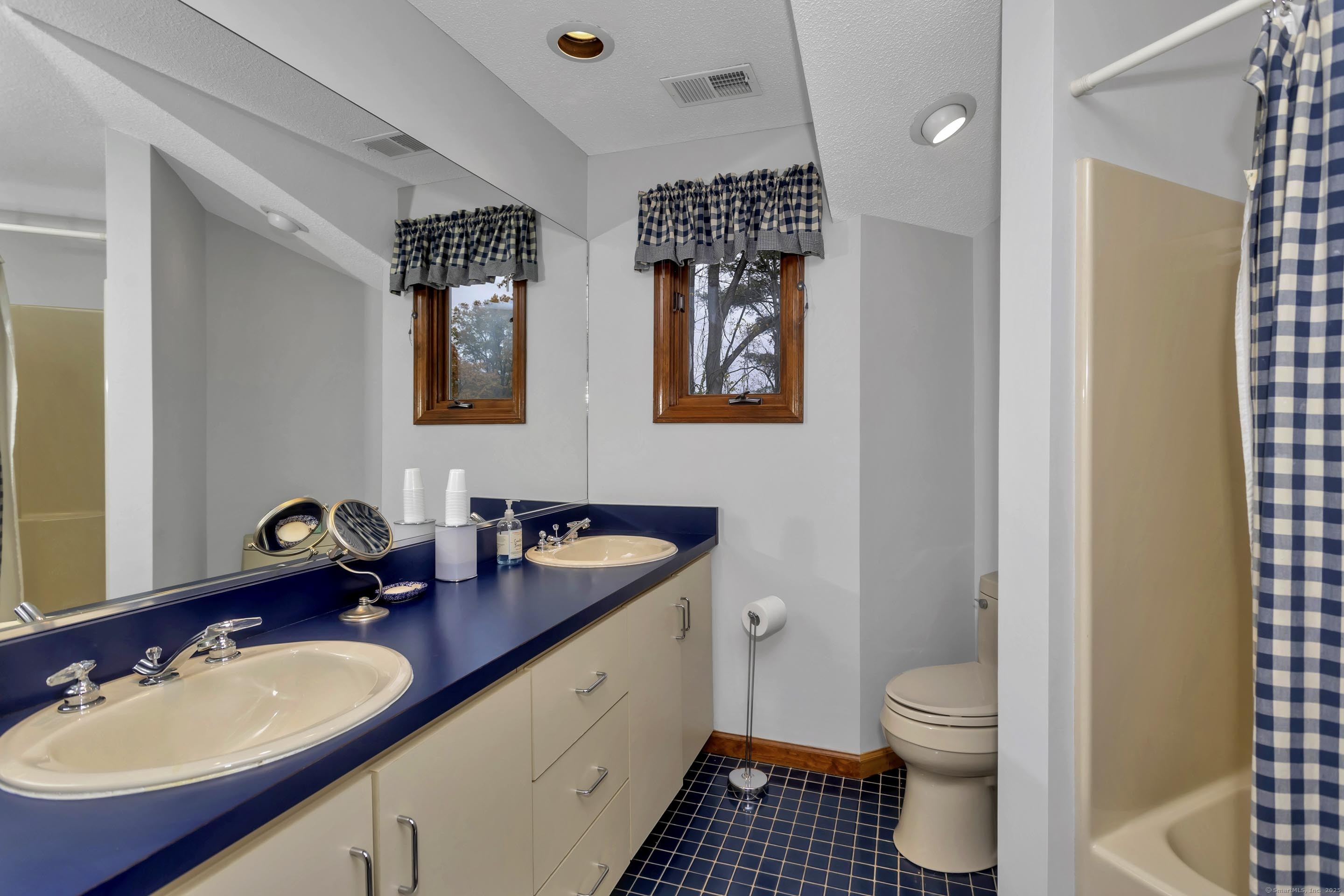41 Huckleberry Hollow Suffield, CT 06078 - Photo 35 of 40 a bathroom with double sink and a mirror