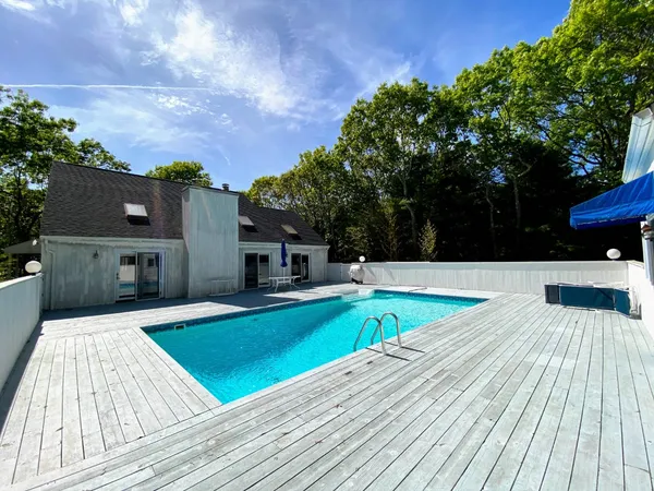 a view of a swimming pool with a patio