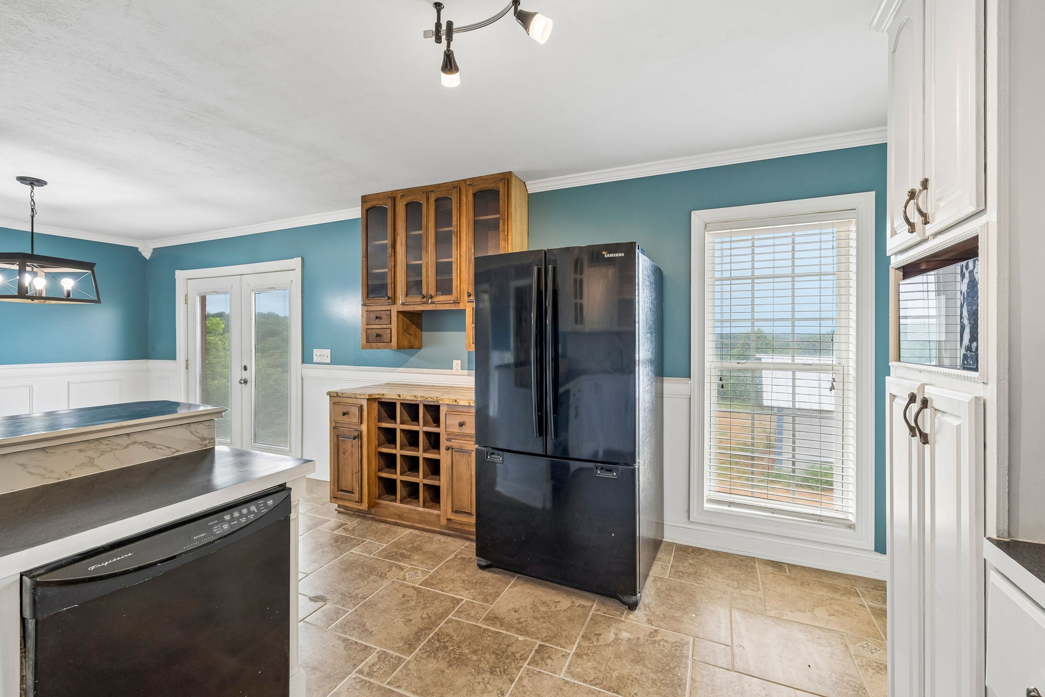 6701 McCormick Ridge Road Whitleyville, TN 38588 - Photo 21 of 63 a kitchen with stainless steel appliances granite countertop a refrigerator and a stove top oven