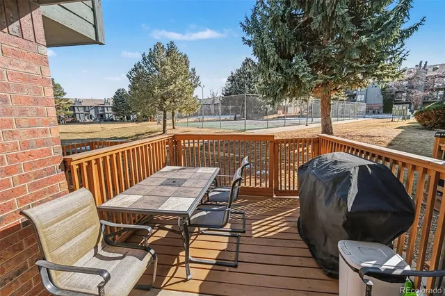 a view of a chairs and table on the deck