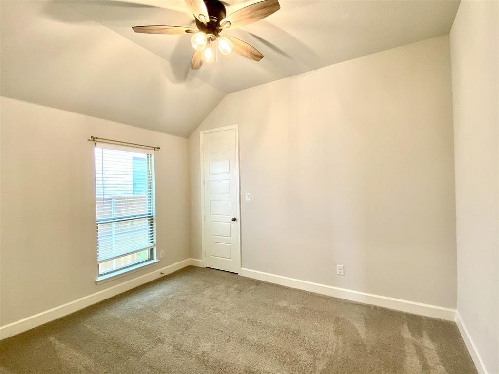 1937 Halkin Road Celina, TX 75009 - Photo 5 of 20 Carpeted room with a vaulted ceiling, featuring a window with blinds, and a ceiling fan with integrated lighting