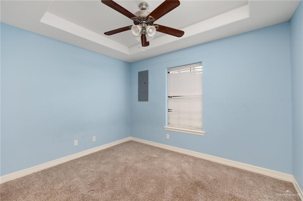 417 Jessica Street Mercedes, TX 78570 - Photo 10 of 12 an empty room with a window and a ceiling fan