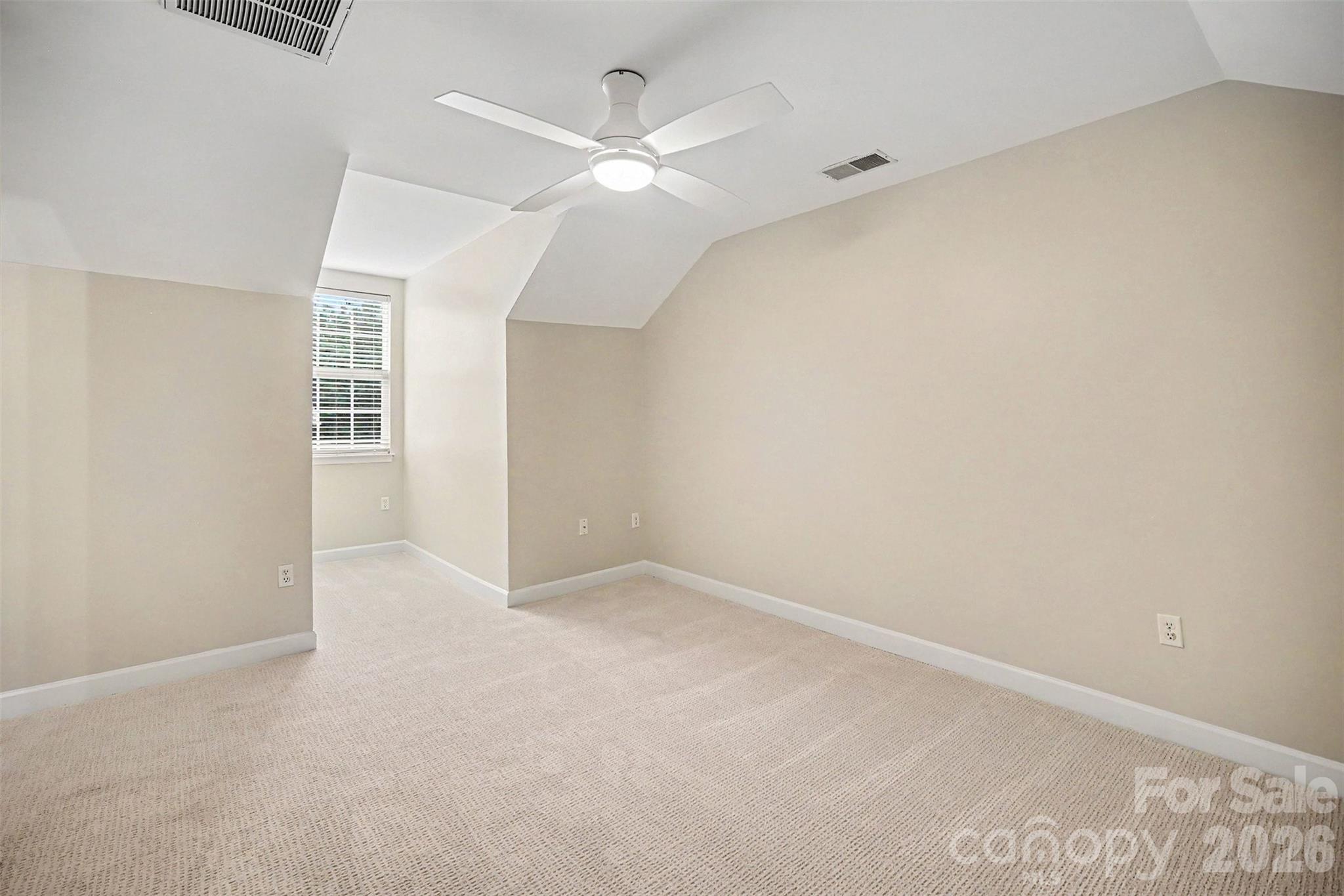 1210 Sheldon Brook Lane Fort Mill, SC 29707 - Photo 16 of 26 an empty room with a ceiling fan and a window