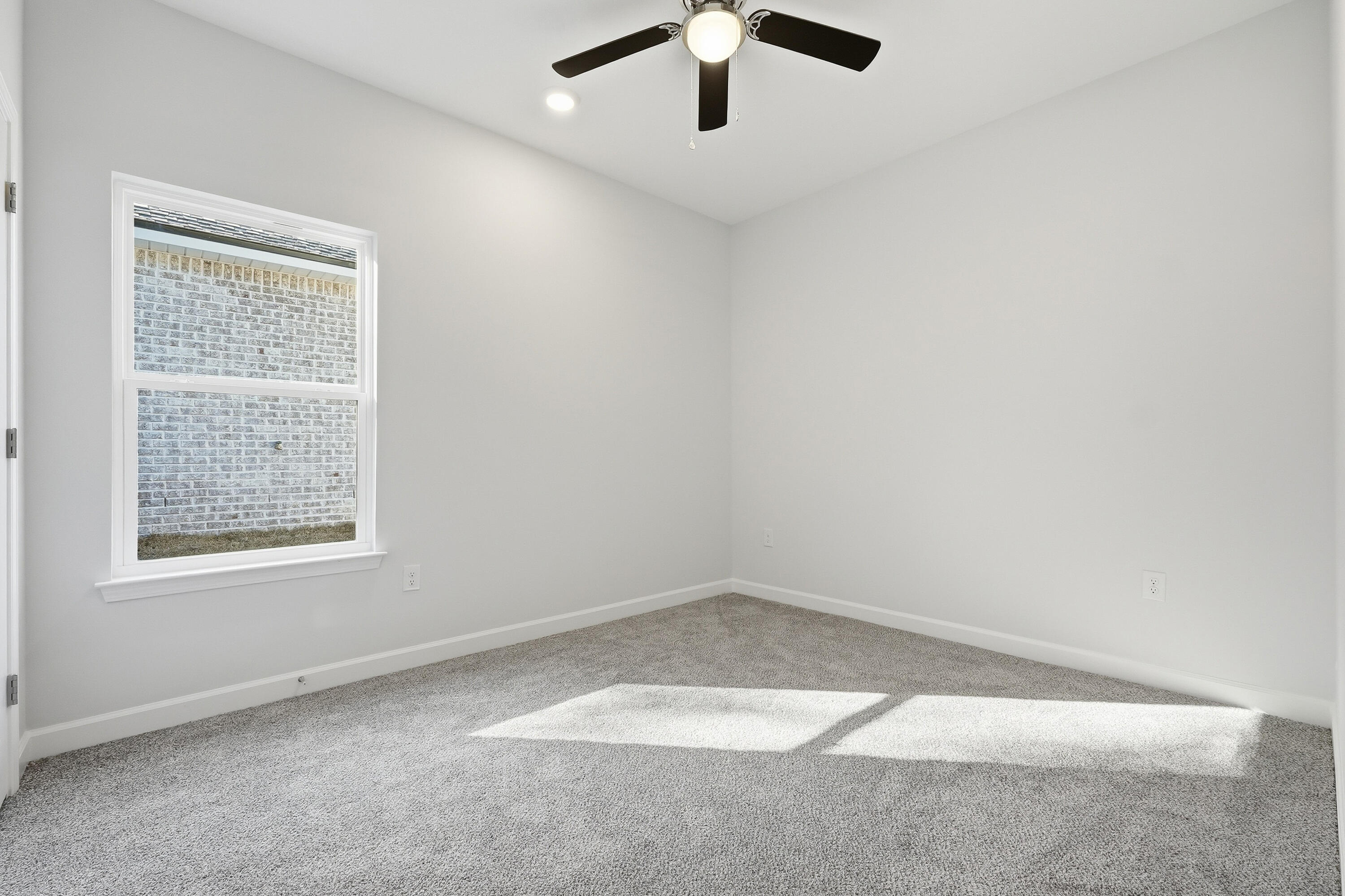 71 Spooner Street DeFuniak Springs, FL 32433 - Photo 16 of 22 an empty room with a window