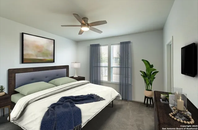 a bedroom with a bed a potted plant and a window