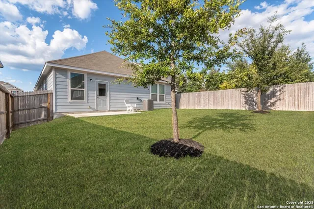 a house that has garden in front of it