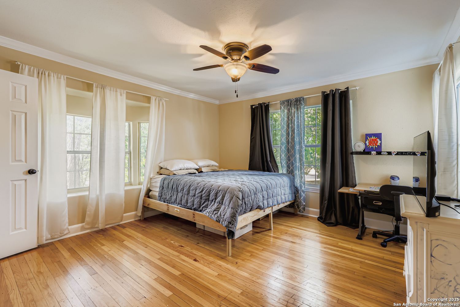 800 Terrell Road San Antonio, TX 78209 - Photo 15 of 28 a bedroom with a bed and wooden floor