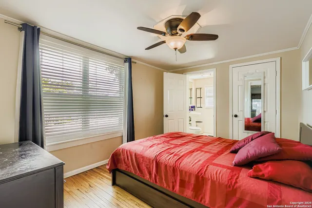 a bedroom with a large bed and a window