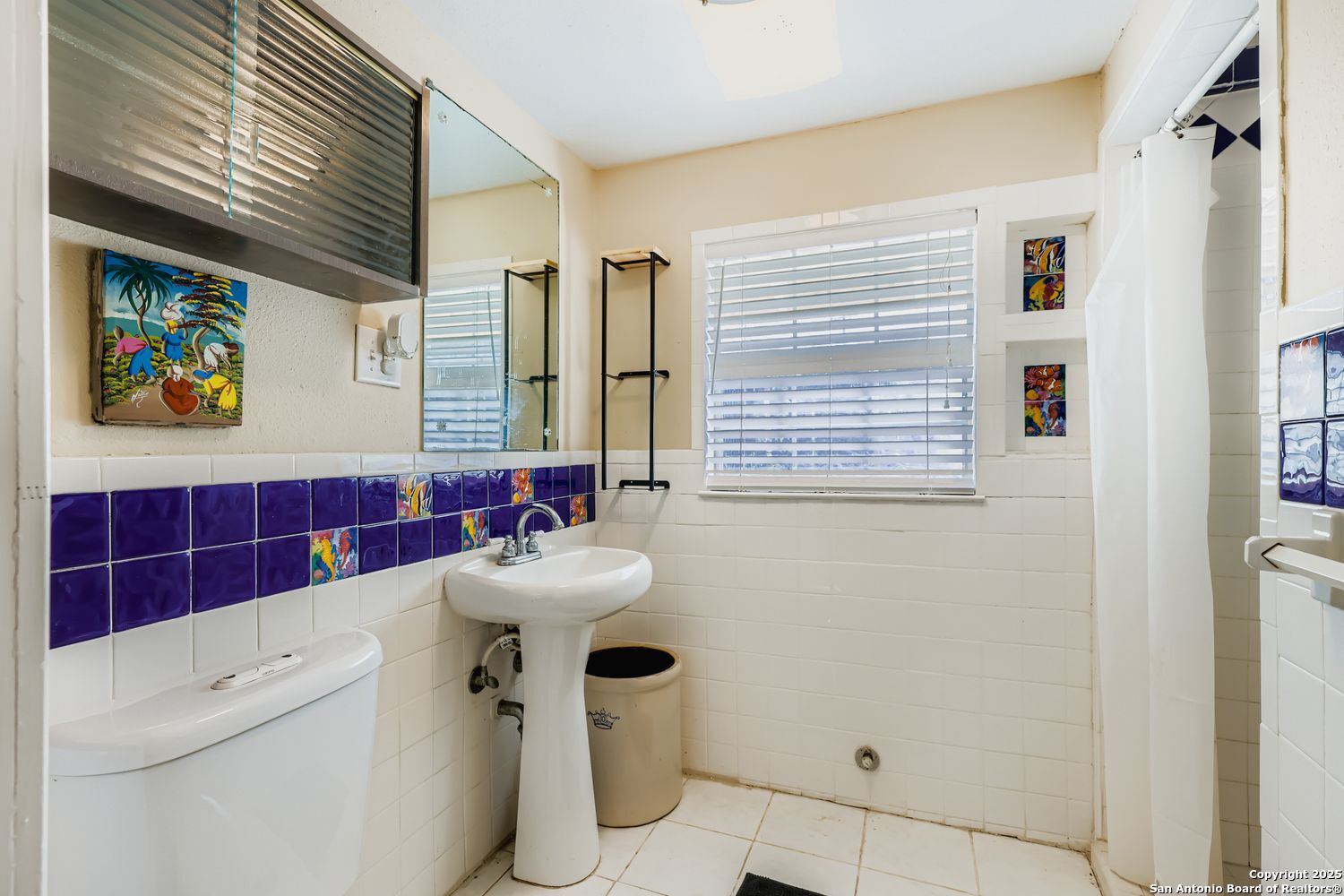 800 Terrell Road San Antonio, TX 78209 - Photo 19 of 28 a bathroom with a sink a mirror and a shower