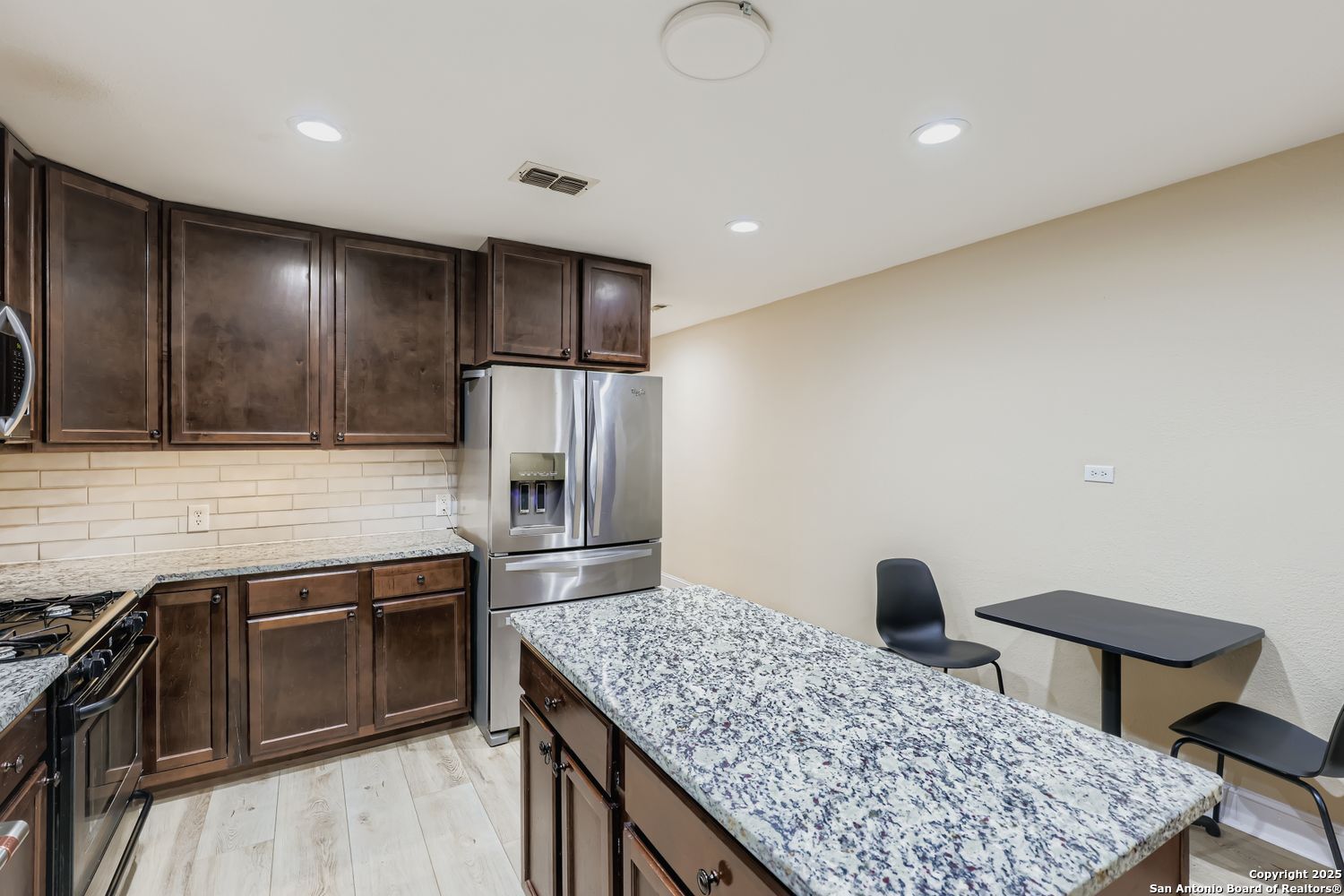 800 Terrell Road San Antonio, TX 78209 - Photo 8 of 28 a kitchen with stainless steel appliances granite countertop a sink stove and refrigerator