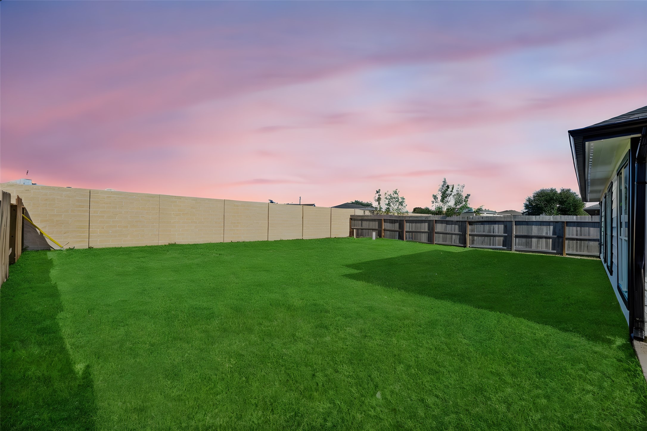 19910 Rustic Lake Lane Cypress, TX 77433 - Photo 16 of 21 a view of a field and a building in the background