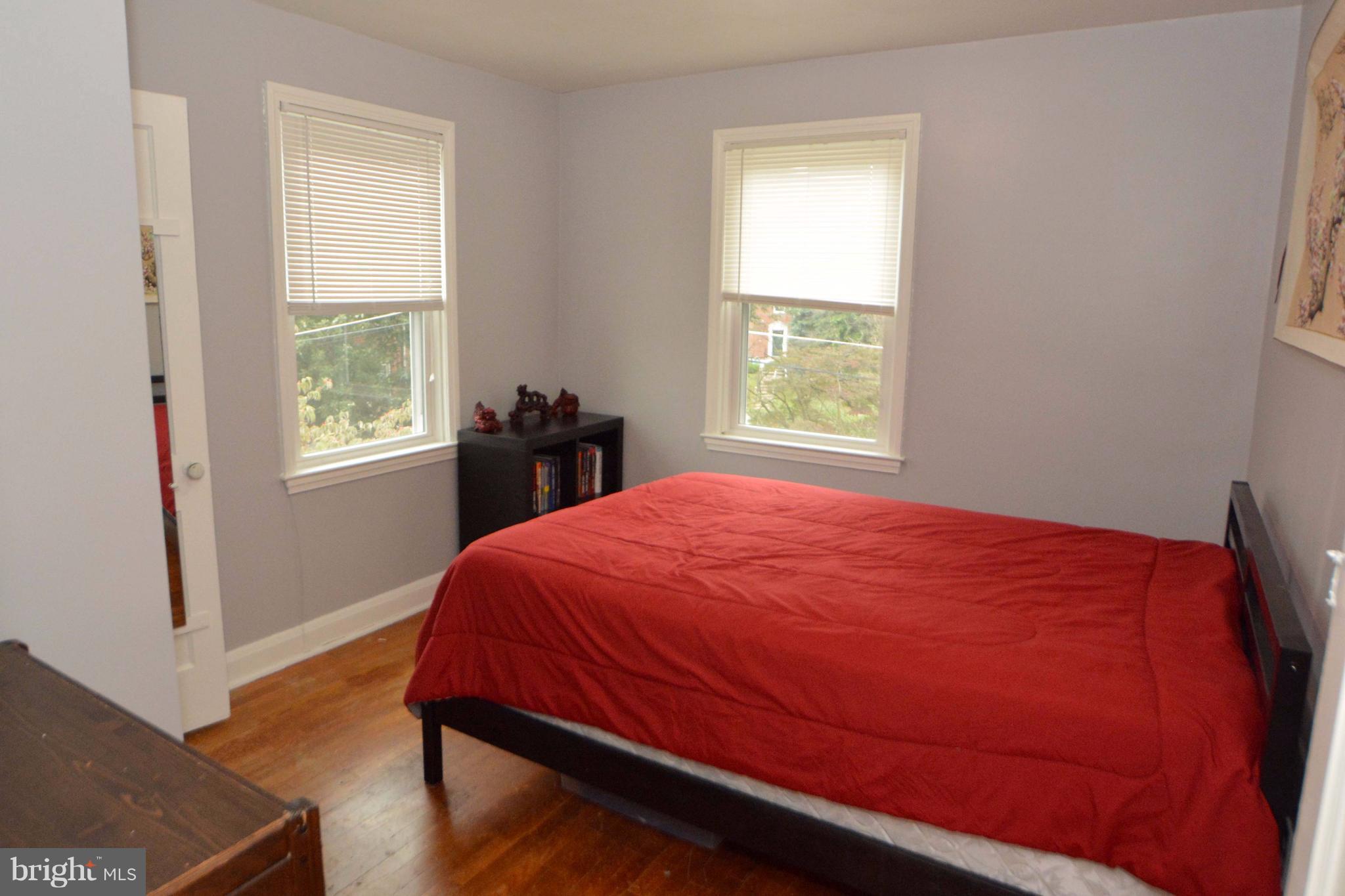 1738 Amuskai Road Baltimore, MD 21234 - Photo 14 of 20 a bed sitting in a bedroom next to a window