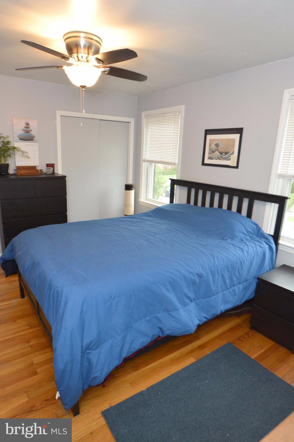 1738 Amuskai Road Baltimore, MD 21234 - Photo 15 of 20 a bedroom with a bed and a chandelier