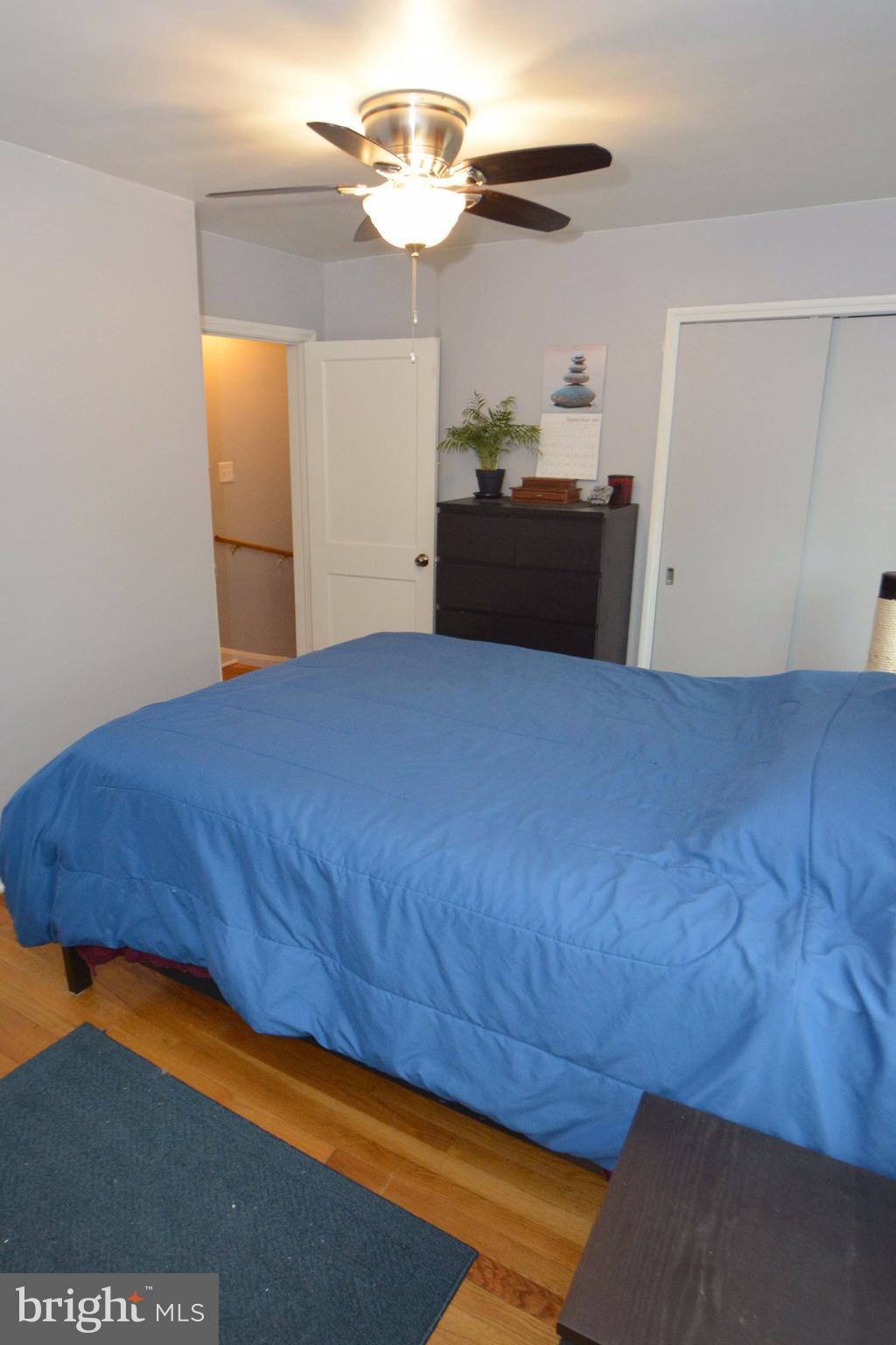 1738 Amuskai Road Baltimore, MD 21234 - Photo 16 of 20 a bedroom with a bed and dresser with mirror