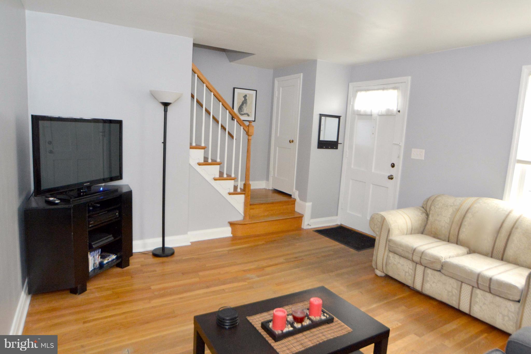 1738 Amuskai Road Baltimore, MD 21234 - Photo 3 of 20 a living room with furniture and a flat screen tv