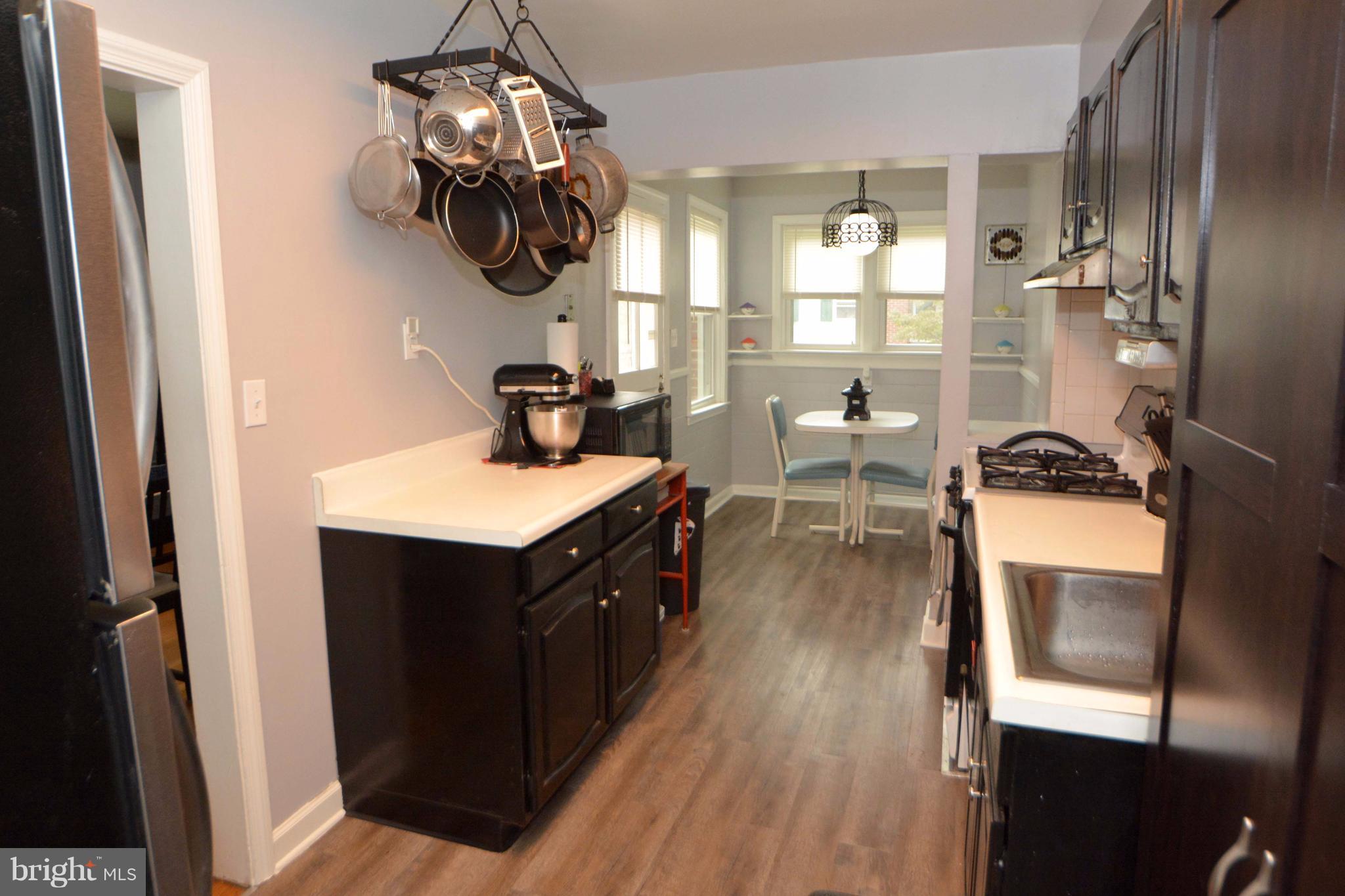 1738 Amuskai Road Baltimore, MD 21234 - Photo 6 of 20 a kitchen with a sink appliances and cabinets