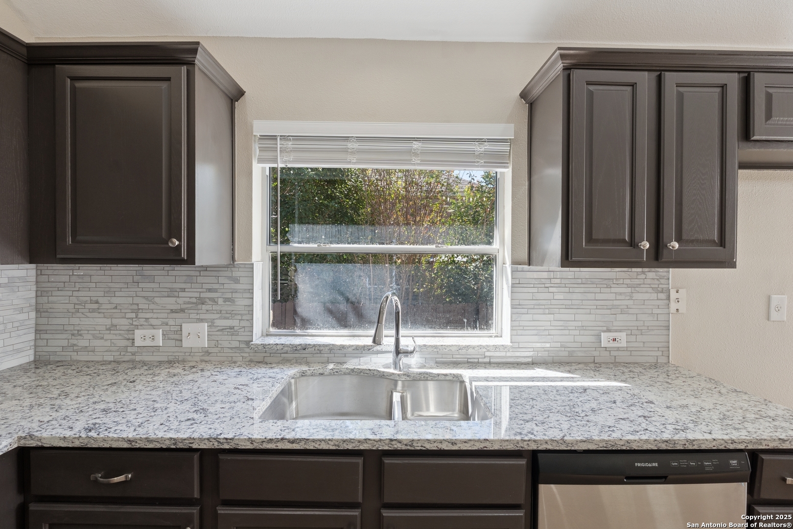 1815 Indian Paint Brush Road San Antonio, TX 78232 - Photo 12 of 38 a kitchen with granite countertop a sink and a window
