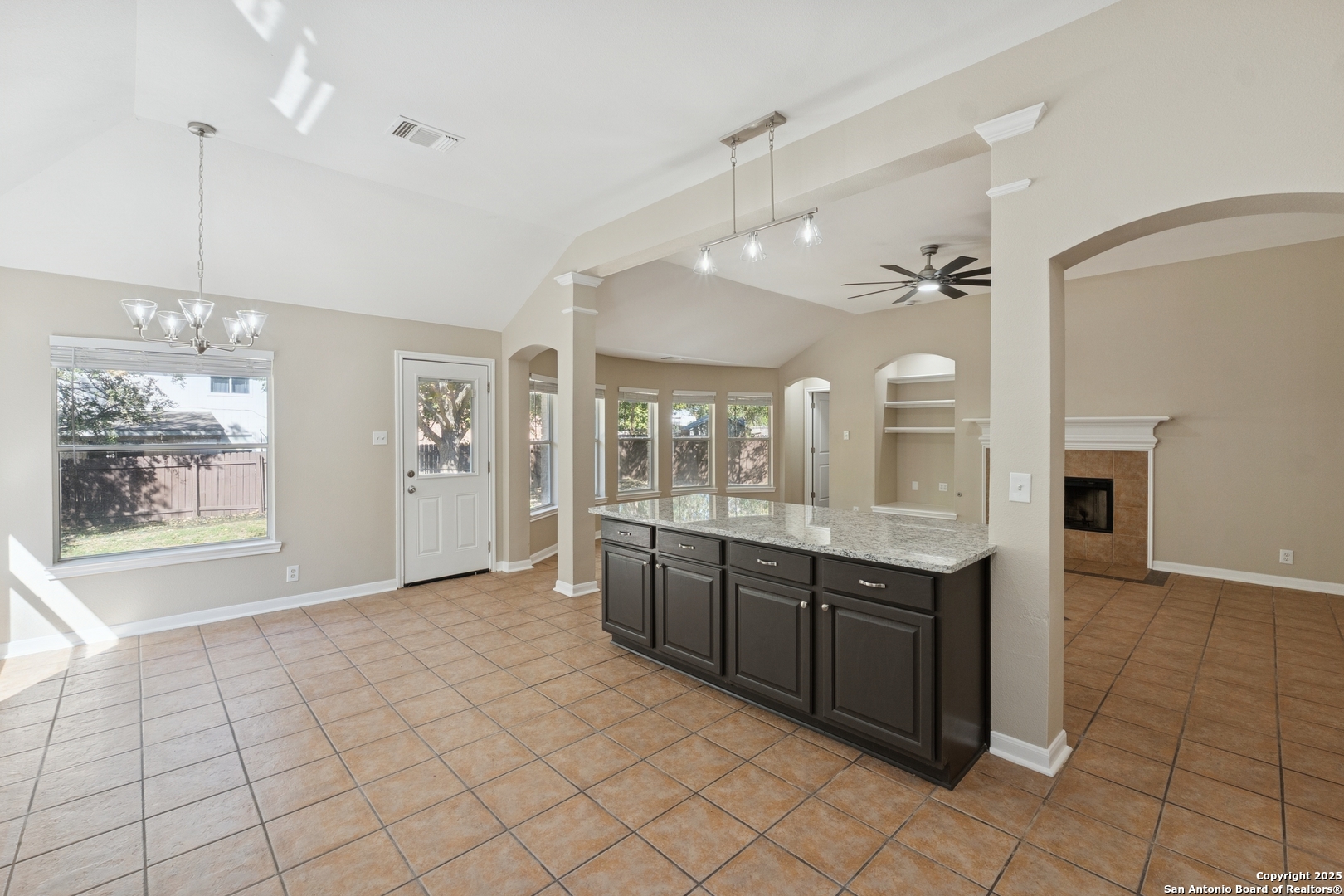 1815 Indian Paint Brush Road San Antonio, TX 78232 - Photo 13 of 38 a large kitchen with granite countertop a sink and cabinets
