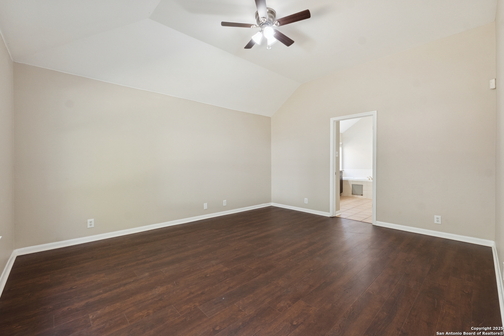 1815 Indian Paint Brush Road San Antonio, TX 78232 - Photo 18 of 38 an empty room with wooden floor fan and windows