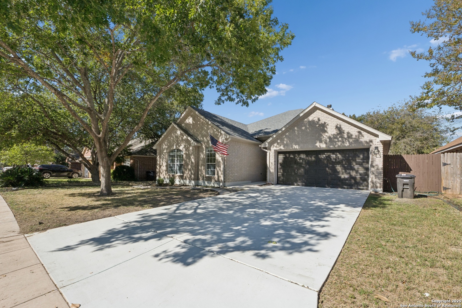 1815 Indian Paint Brush Road San Antonio, TX 78232 - Photo 2 of 38 a front view of a house with a yard and garage