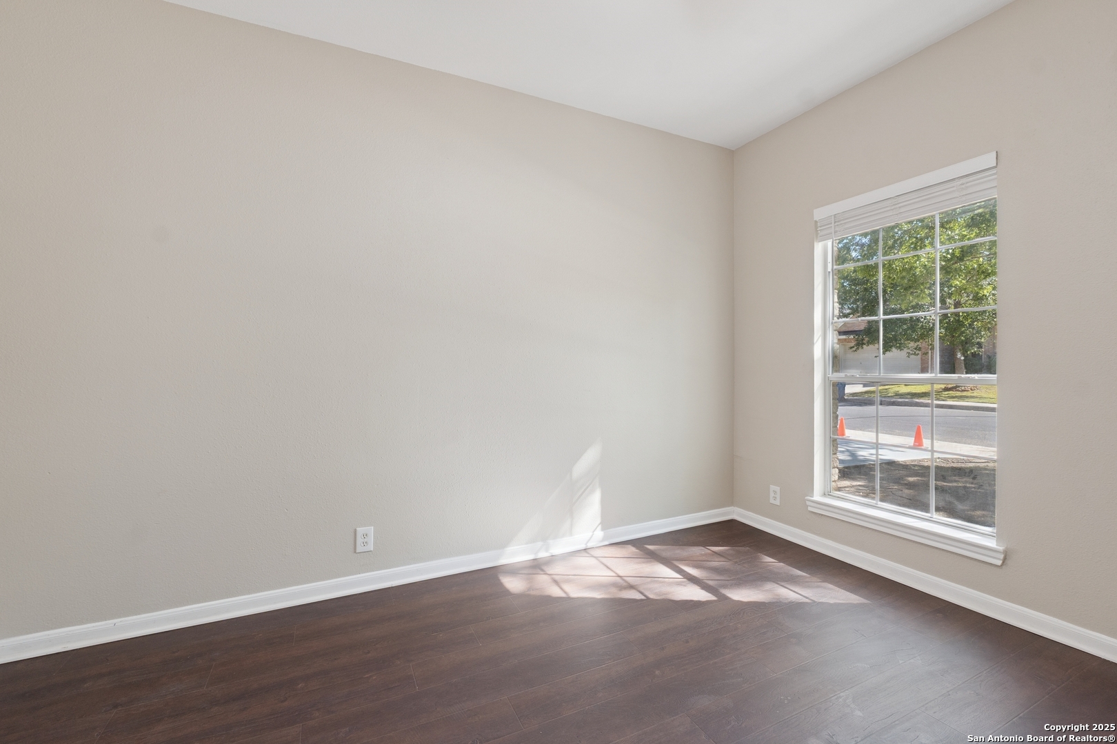 1815 Indian Paint Brush Road San Antonio, TX 78232 - Photo 26 of 38 an empty room with wooden floor and windows