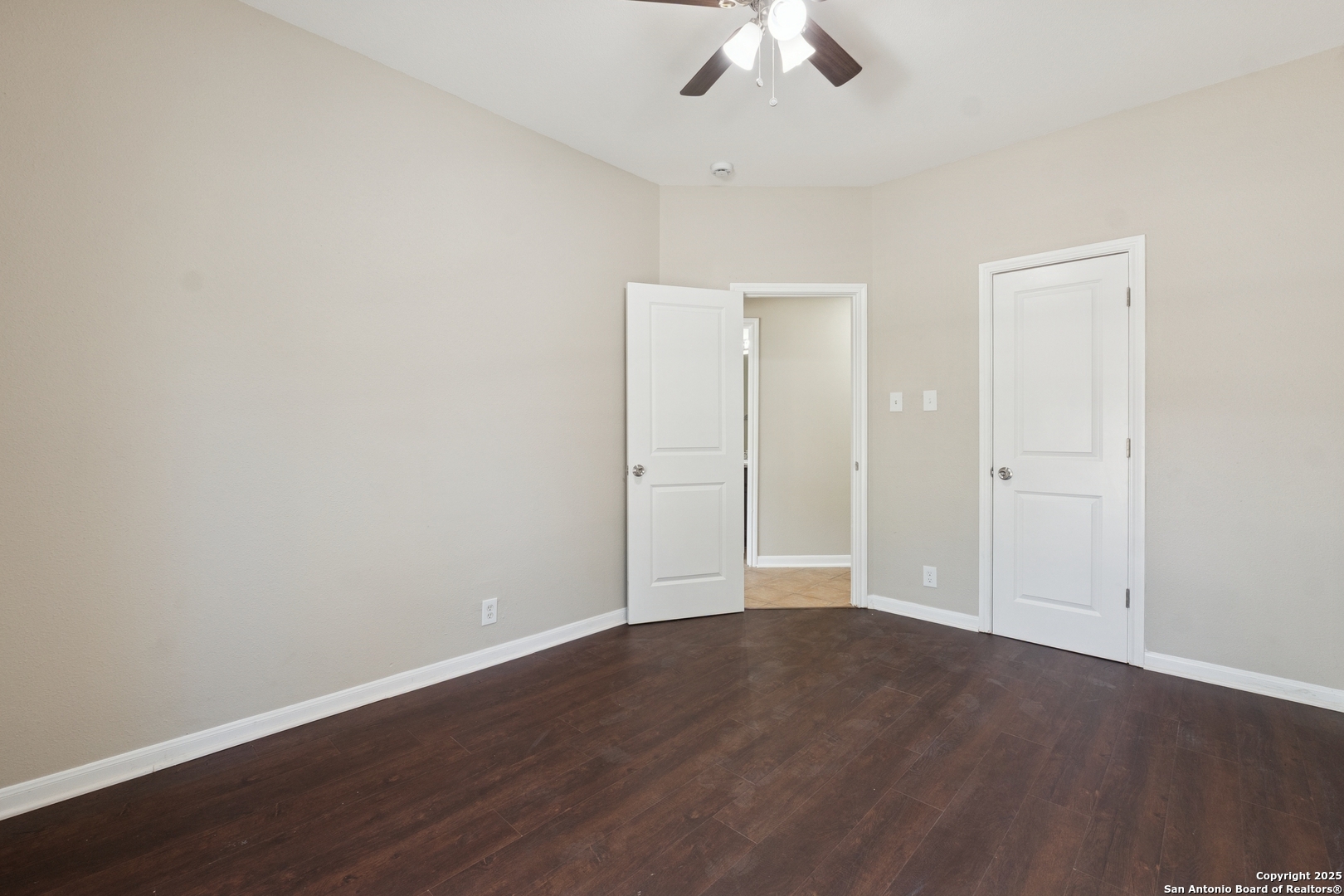 1815 Indian Paint Brush Road San Antonio, TX 78232 - Photo 27 of 38 an empty room with wooden floor fan and window