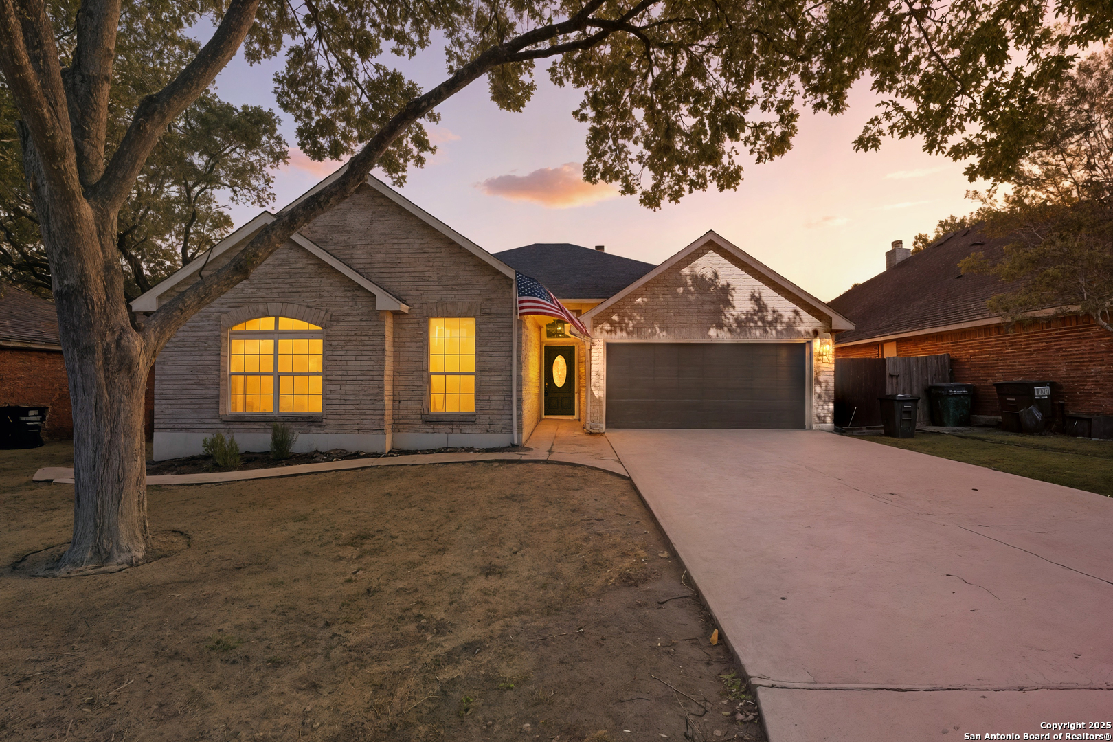 1815 Indian Paint Brush Road San Antonio, TX 78232 - Photo 3 of 38 a front view of a house with a yard and garage