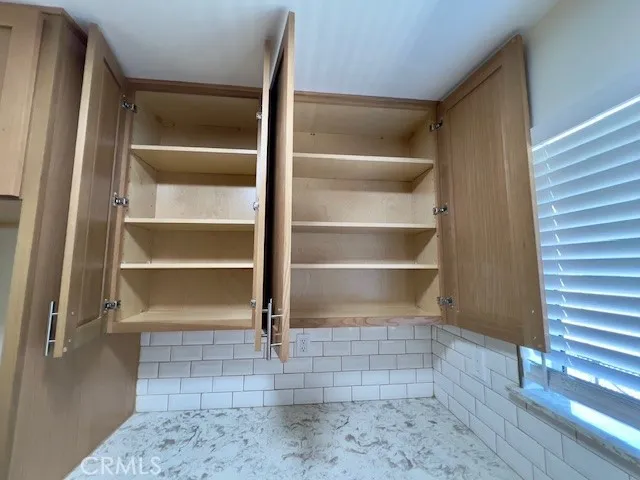 a view of a hallway with a bathroom