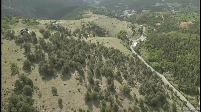 a view of a town with mountains in the background