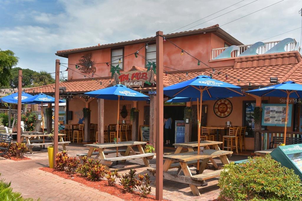 6157 Midnight Pass Road, Unit E63 Sarasota, FL 34242 - Photo 56 of 61 a view of a cafe with sitting area