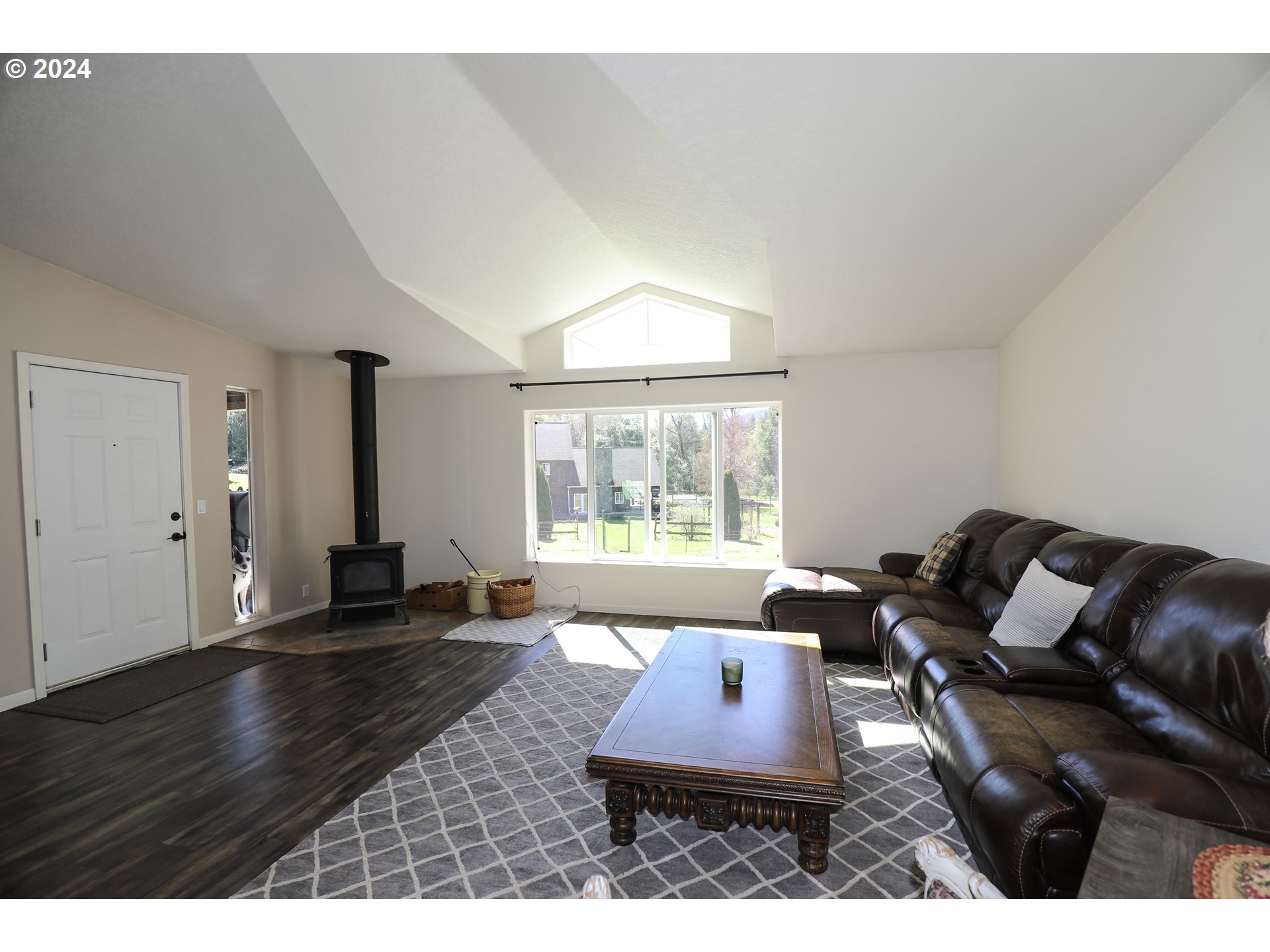 6910 Upper Olalla Road Winston, OR 97496 - Photo 22 of 48 a living room with furniture and a large window
