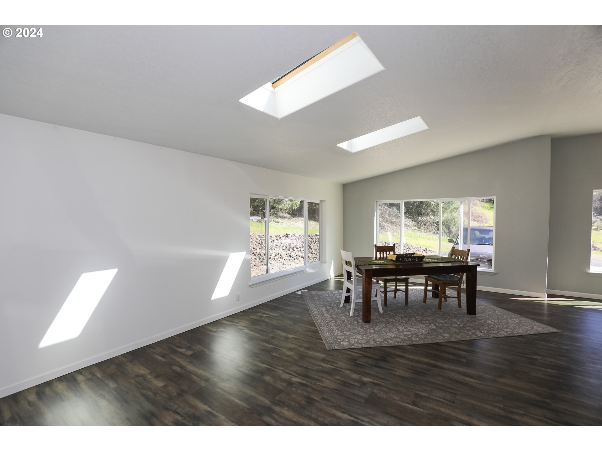 6910 Upper Olalla Road Winston, OR 97496 - Photo 24 of 48 a view of a dining room with furniture and wooden floor
