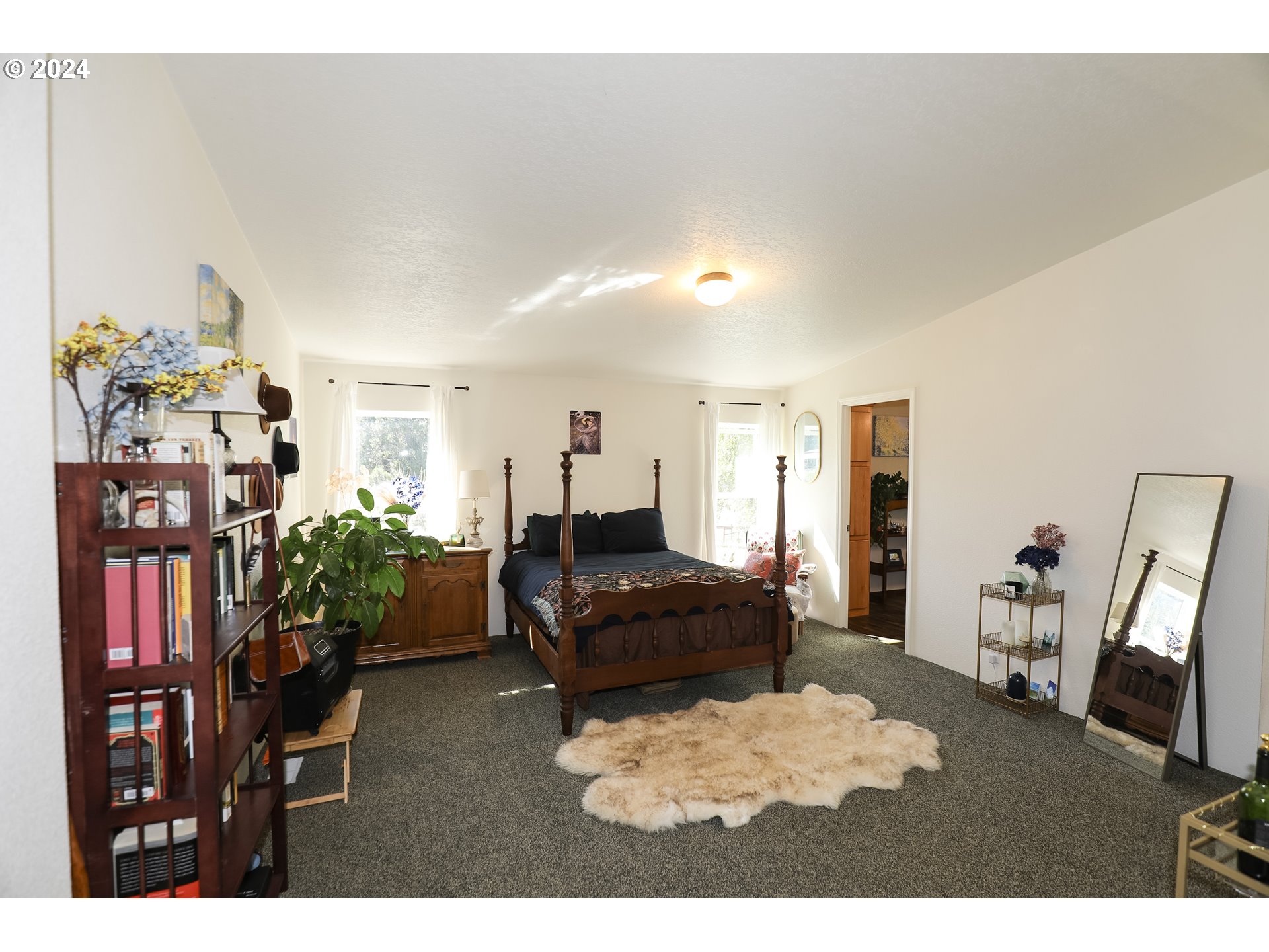 6910 Upper Olalla Road Winston, OR 97496 - Photo 26 of 48 a living room with furniture and a flat screen tv