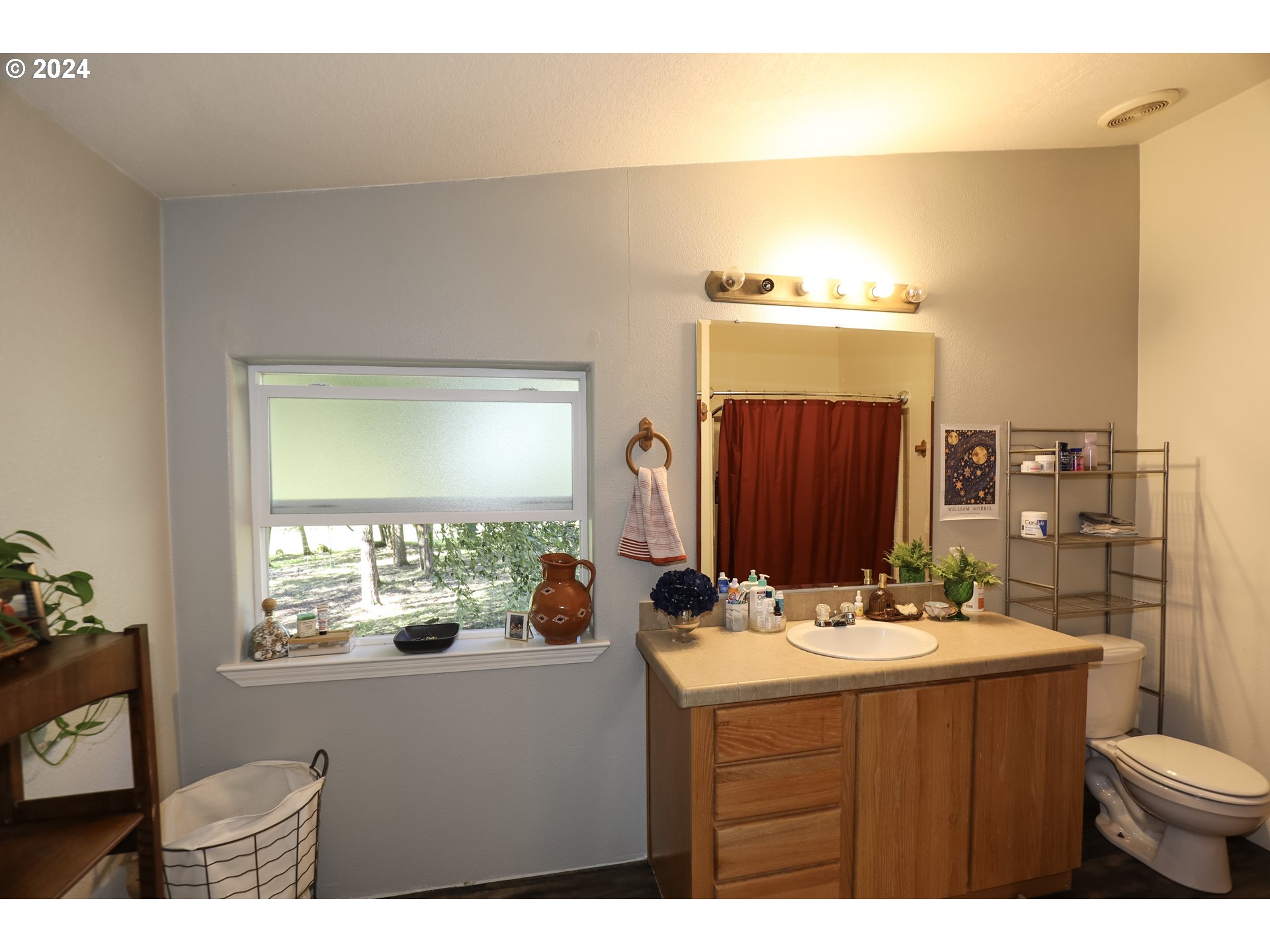 6910 Upper Olalla Road Winston, OR 97496 - Photo 27 of 48 a bathroom with a sink vanity granite and a mirror